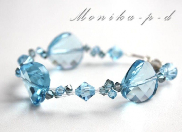 538B. Kryształy Swarovski aquamarine i aquamarine satin na srebrze - bransoletka
kryształy największe 18mm
małe kryształki 4mm i 8mm
wykończenie w srebrze